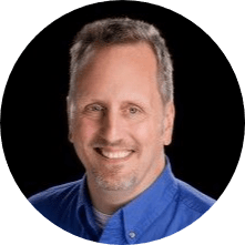 Portrait of a zumBrunnen team member in a blue shirt, circle crop