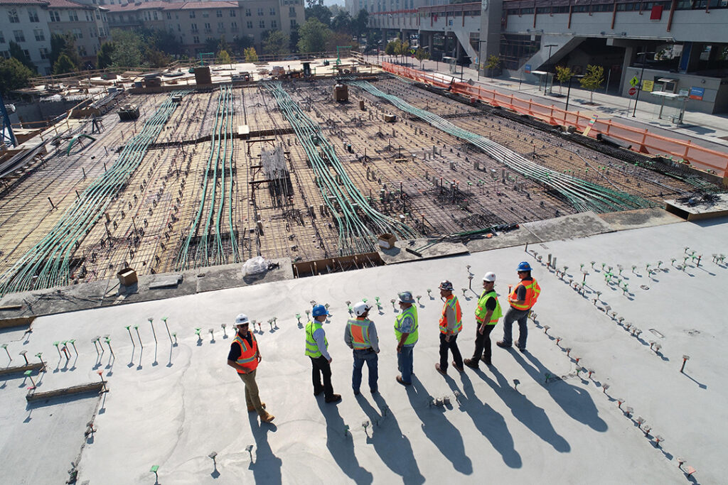 A group of construction monitors explaining the importance of construction loan monitoring