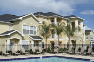 Gray Company apartment buildings beside a community swimming pool
