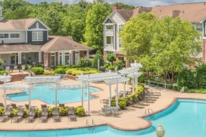 Aerial view of an apartment community with a swimming pool