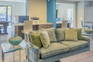 Apartment clubhouse lounge with sofas and natural light