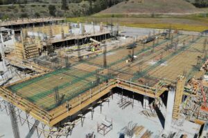 created by dji camera Aerial view of foundation and framing in progress at Enso Village