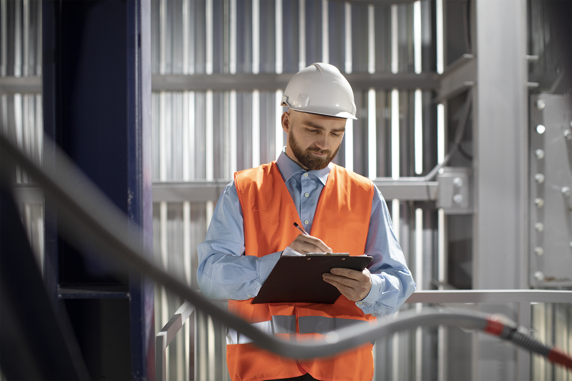 Engineer performing property condition assessment with checklist at senior living facility – zumBrunnen construction consulting