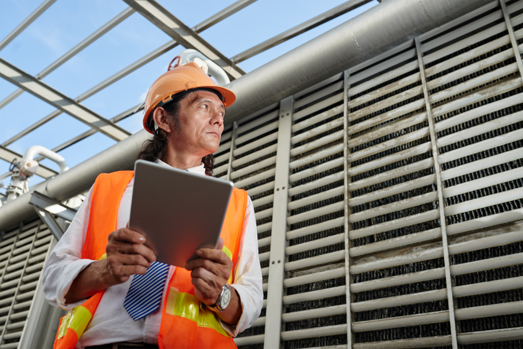 Mobile chat screen overlaying a construction setting, symbolizing communication gaps and delayed decisions that contribute to deferred maintenance risks in senior living capital planning.